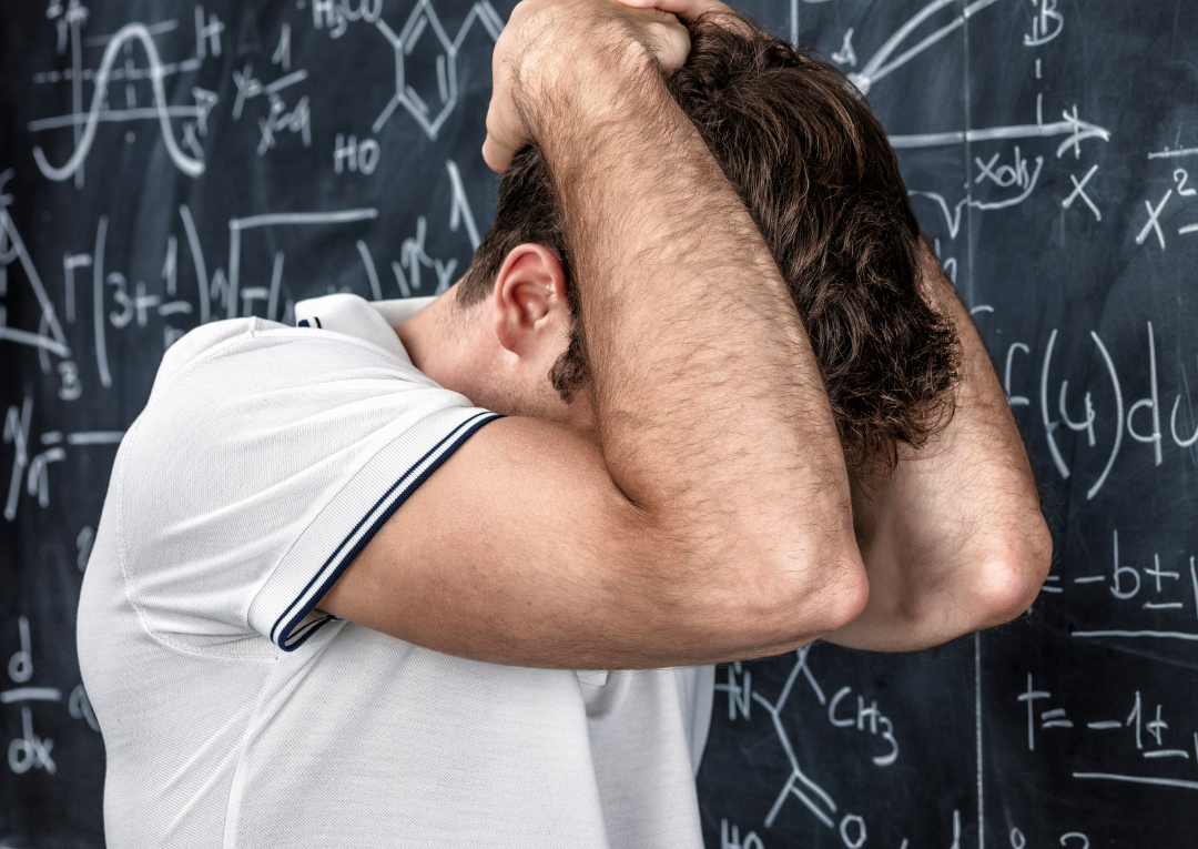 nervous teacher in front of blackboard